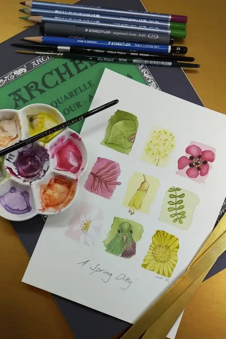 Tiny watercolour paintings of flowers and a bird along with art supplies