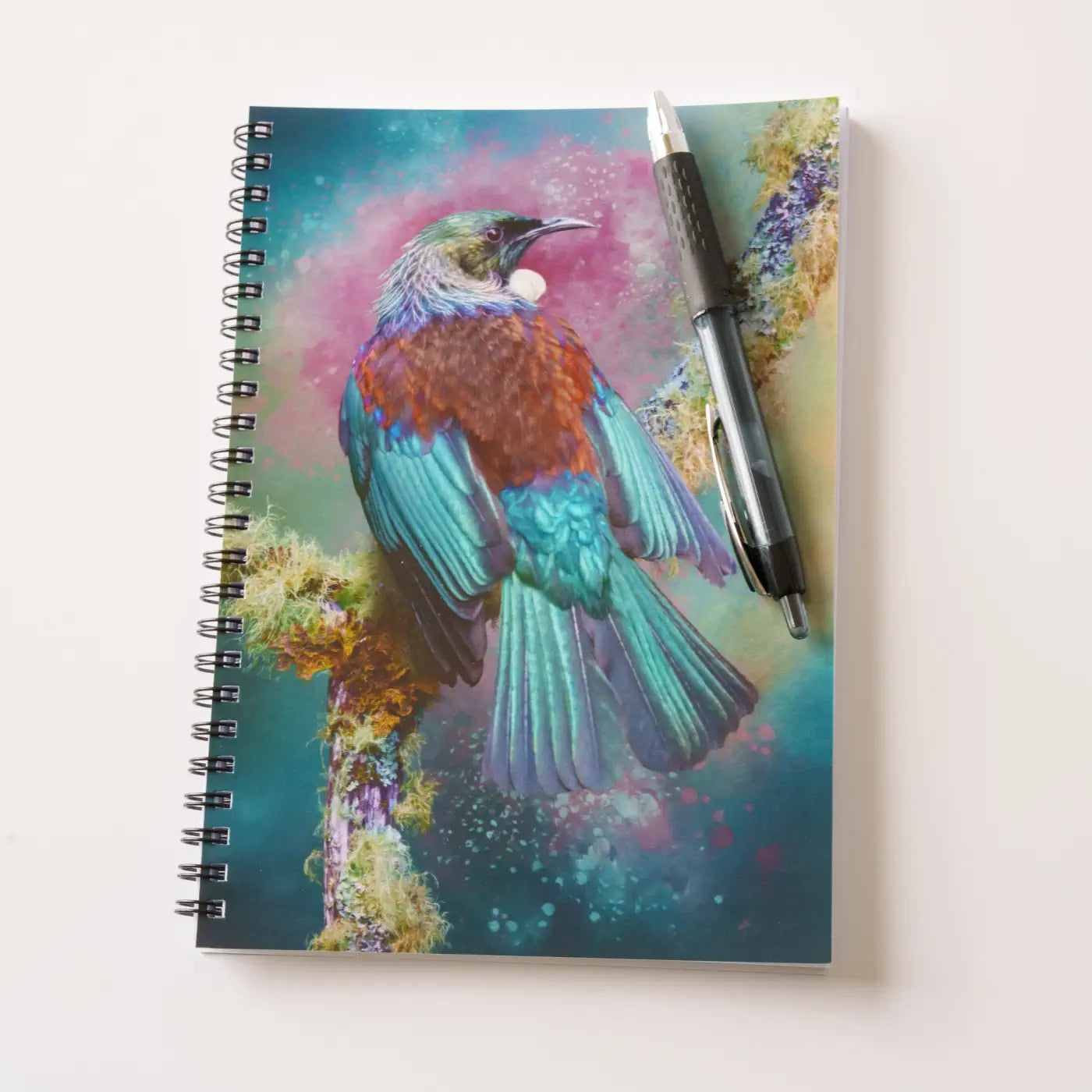 tui notebook with a gel pen