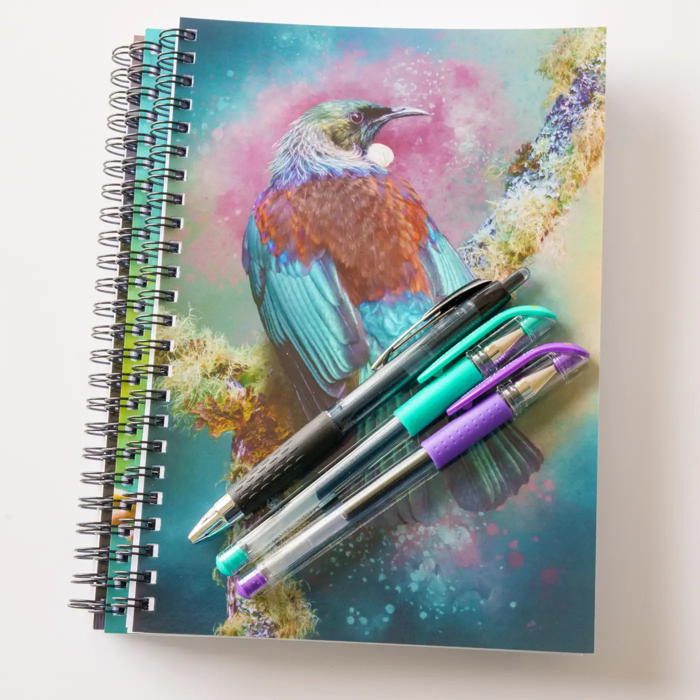 three notebooks with three gel pens