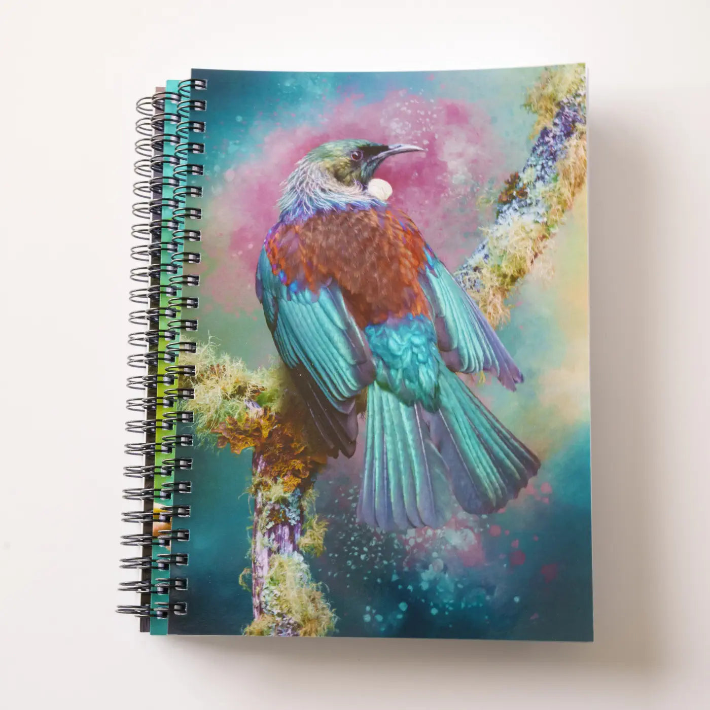 three tui notebooks in a stack