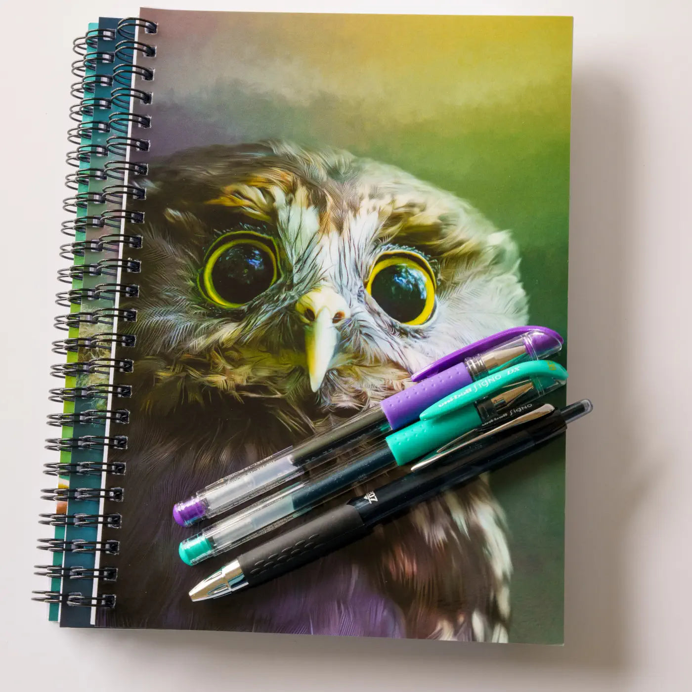 three notebooks nad three pens
