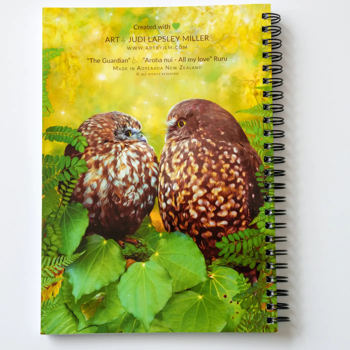 back cover of Judi's owl notebook with two beautiful moreporks