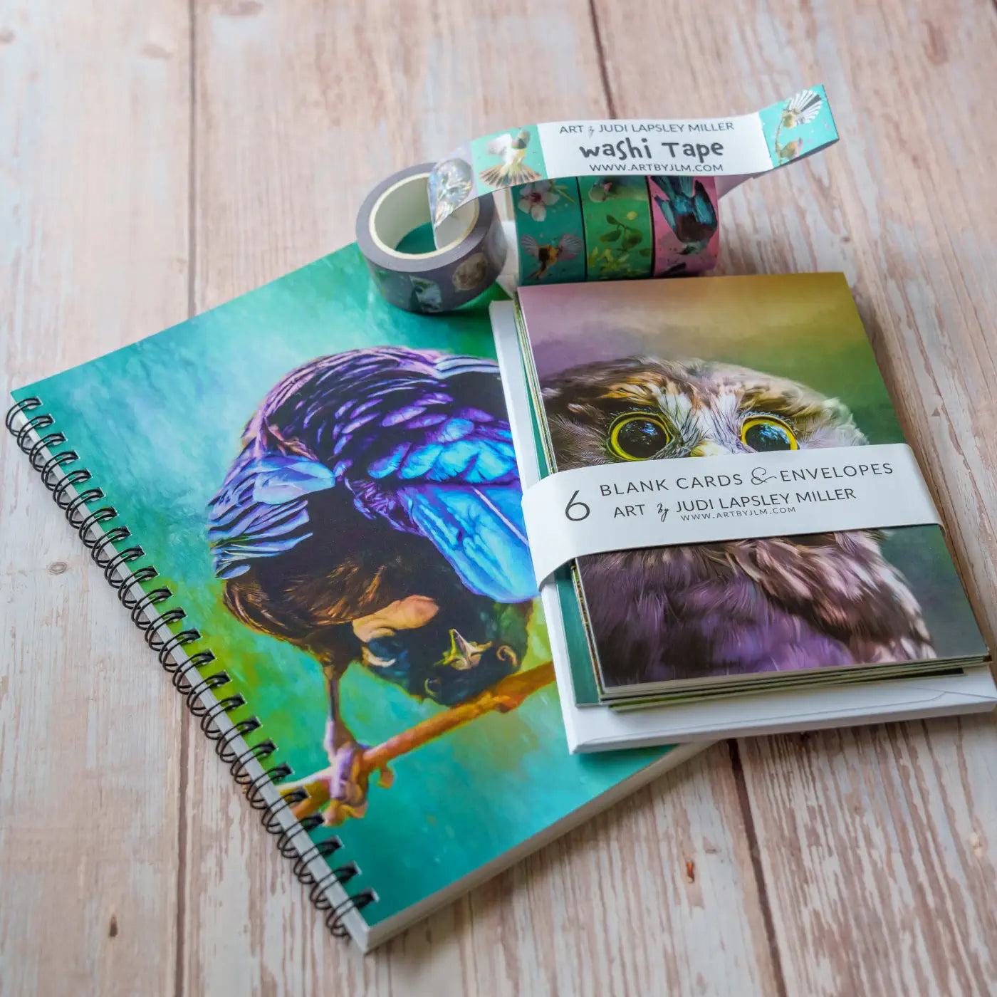 Quirky tui notebook, 6 card bundle, and 4-pack washi tapes all by artist Judi Lapsley Miller