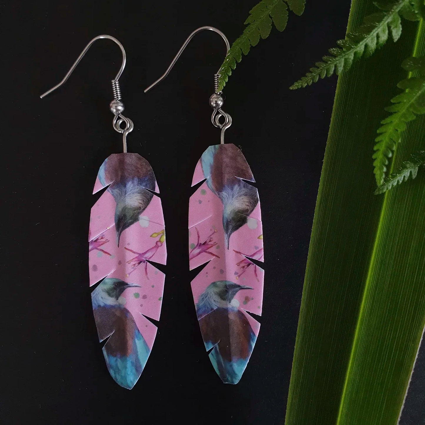 Feather earrings with bird design