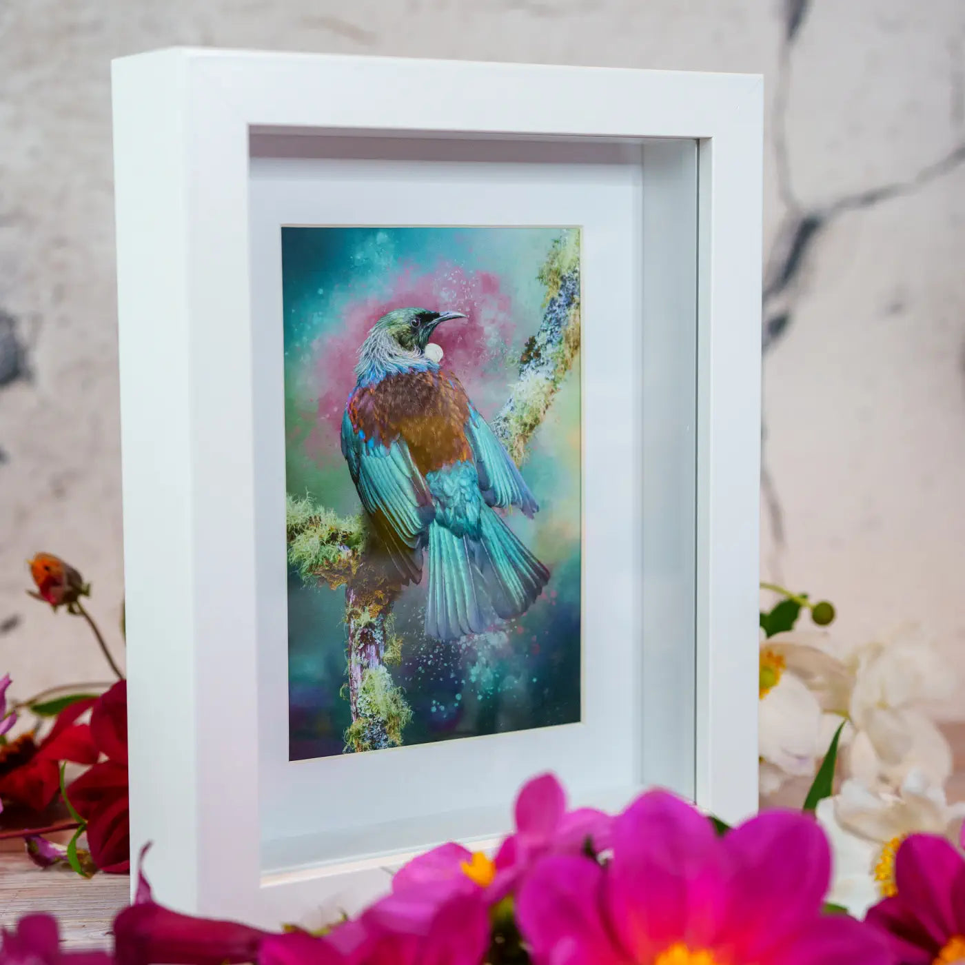 side angle of a framed tui artwork