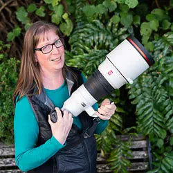 Photo of Judi holding a big camera