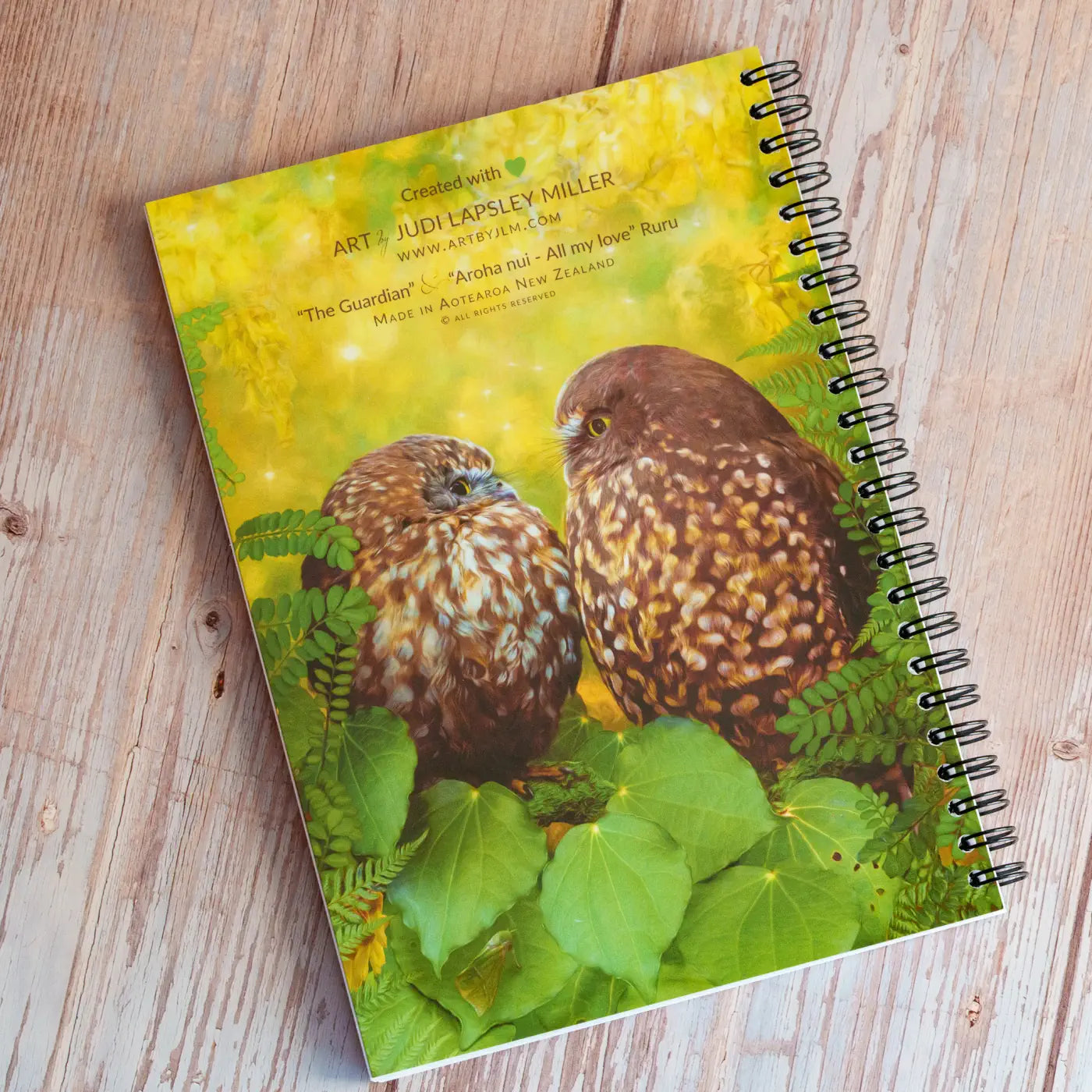 spiral bound notebook with two owls on the back cover