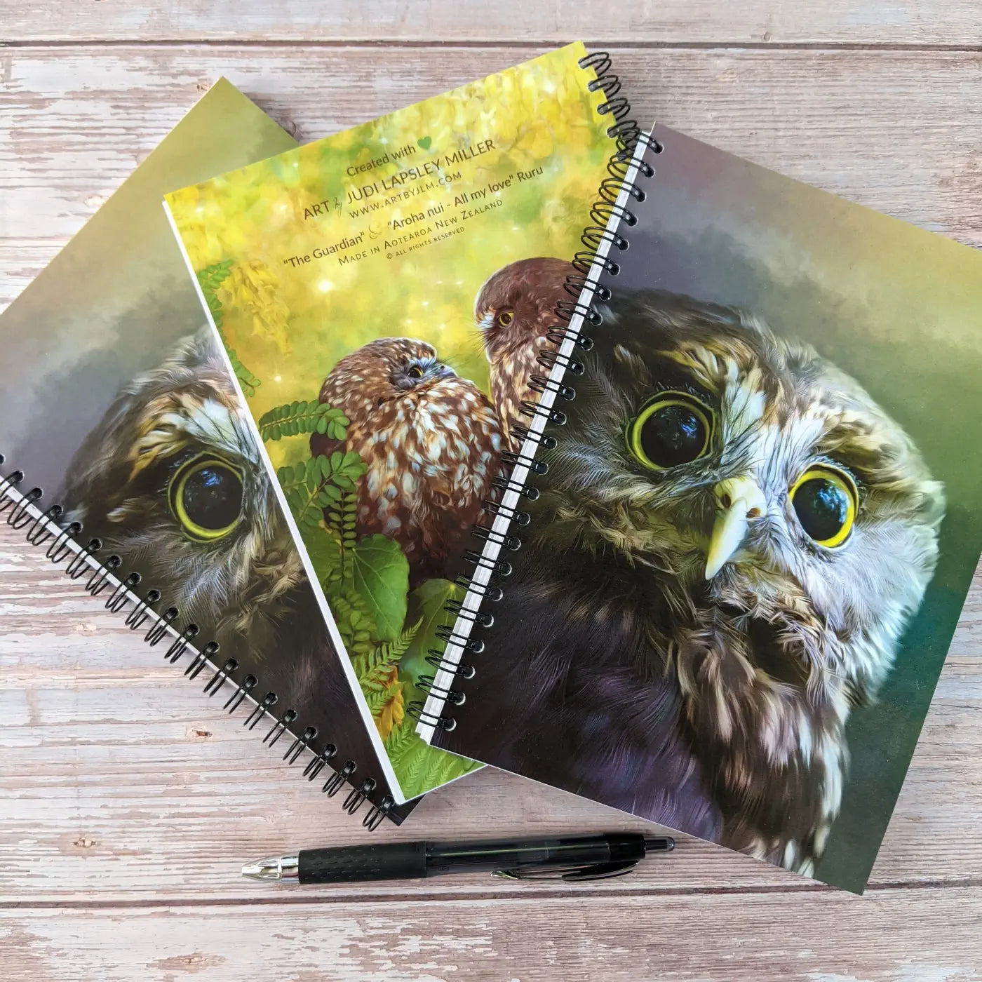 3 notebooks with owls and 1 pen