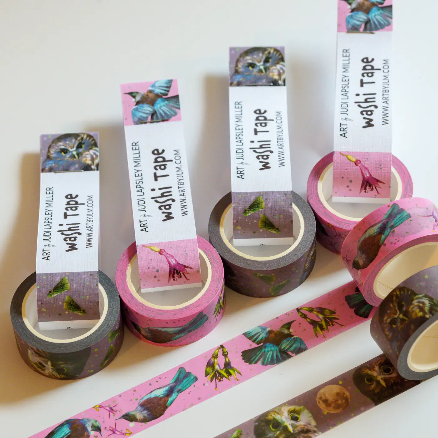6 rolls of washi tape with cardboard labels looped through