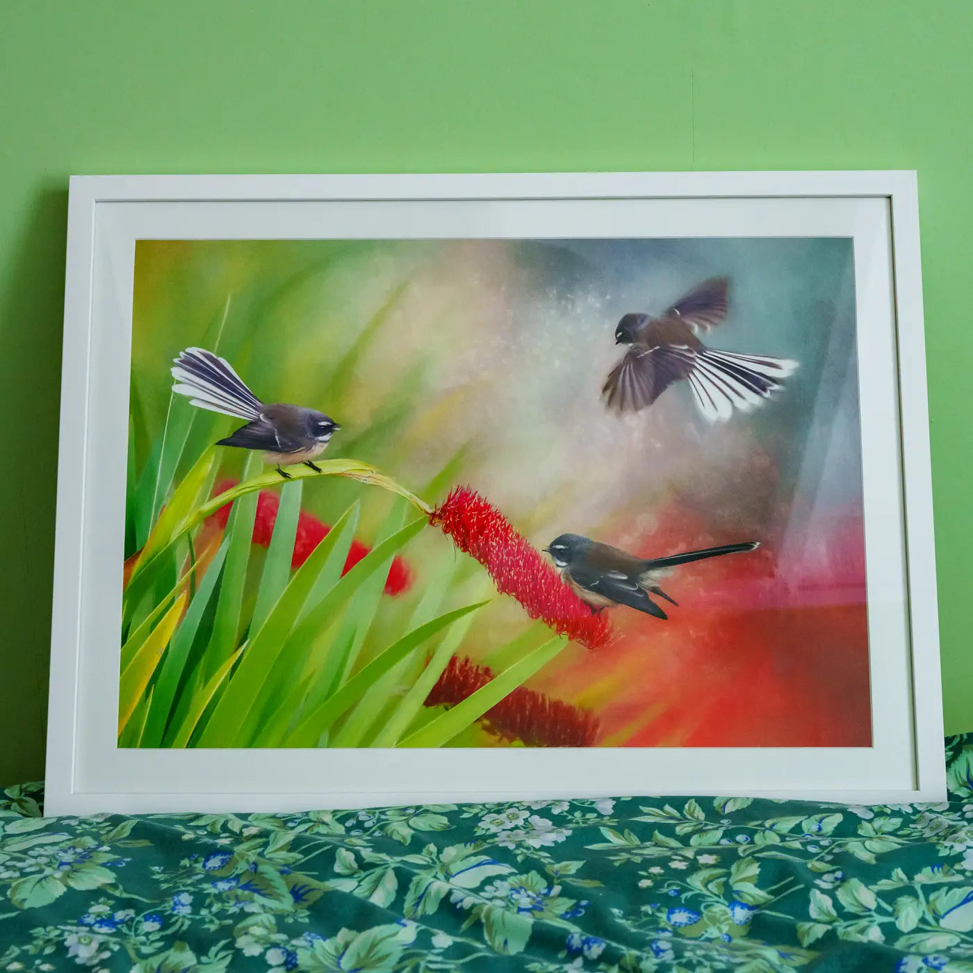 artwork of three fantails in a white frame