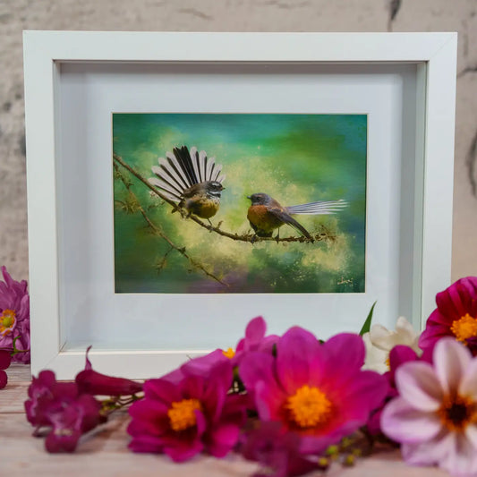 framed artwork of two birds