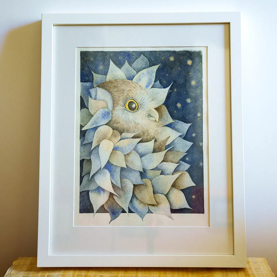 Framed artwork of an owl amongst leaves