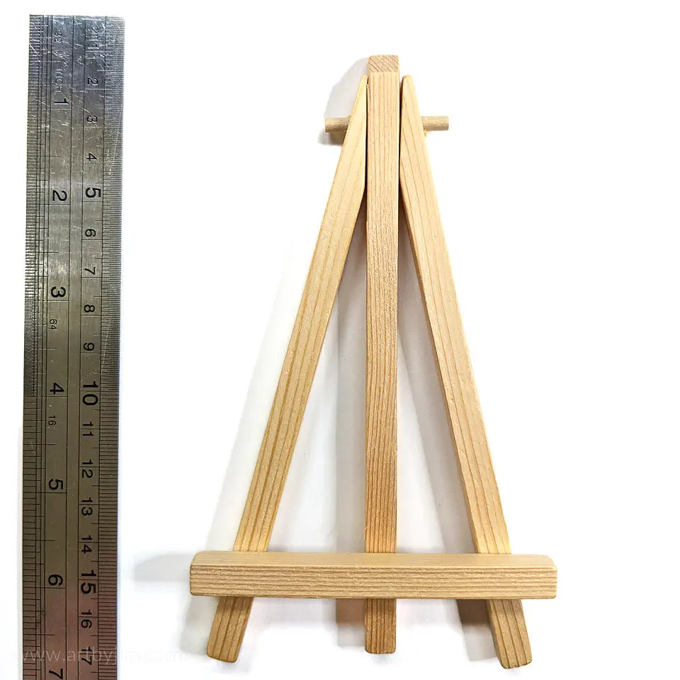 Tiny easel made of wood with ruler for scale